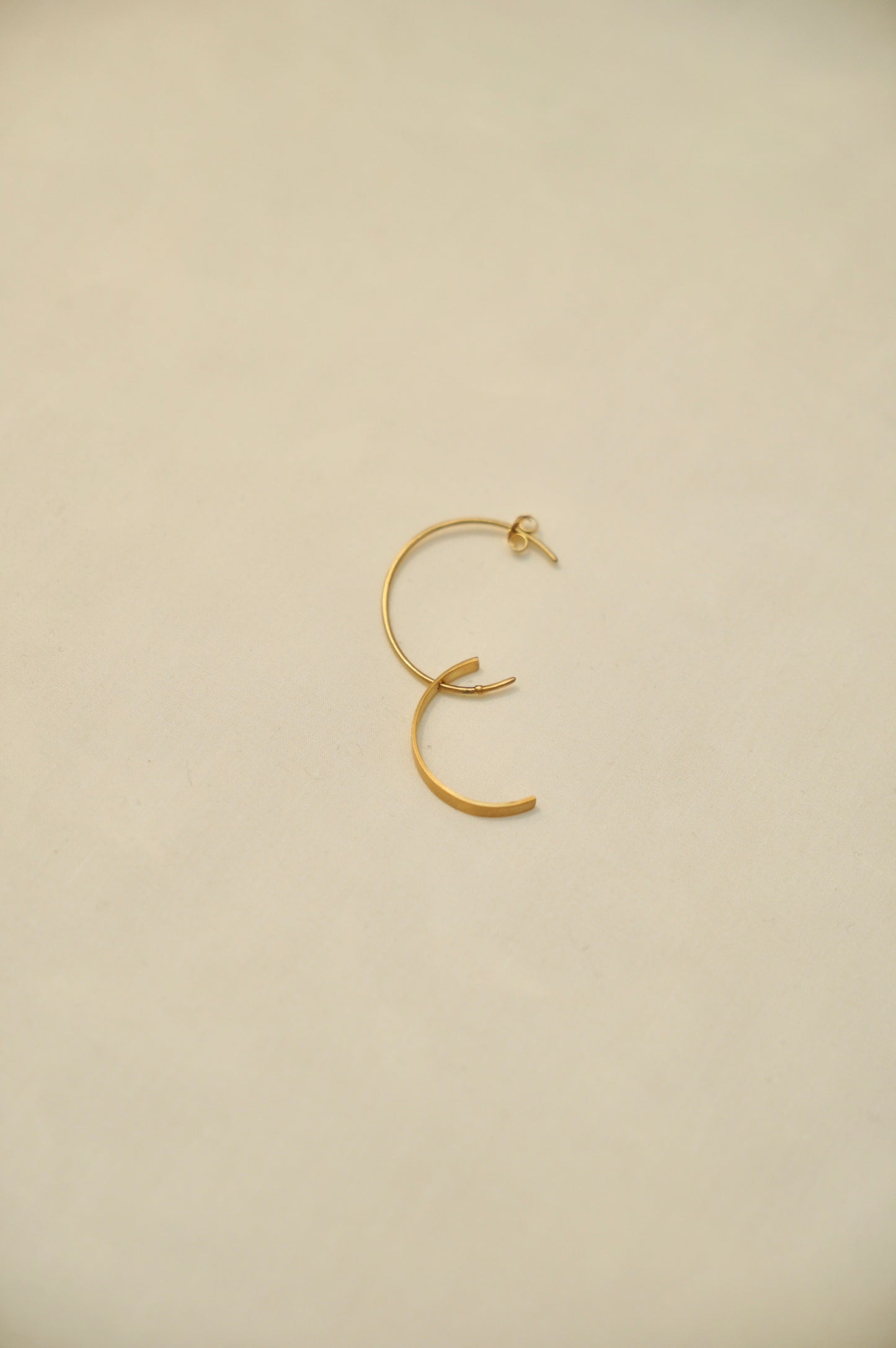 M pierced earring